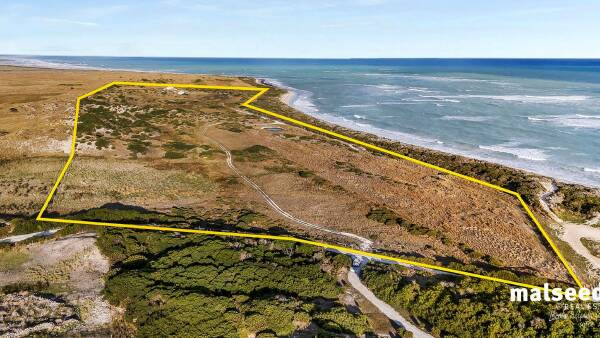 Big stretch of private beach for sale right on the border