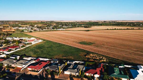 Crop the land or build a new suburb, town developers to ponder farm sale